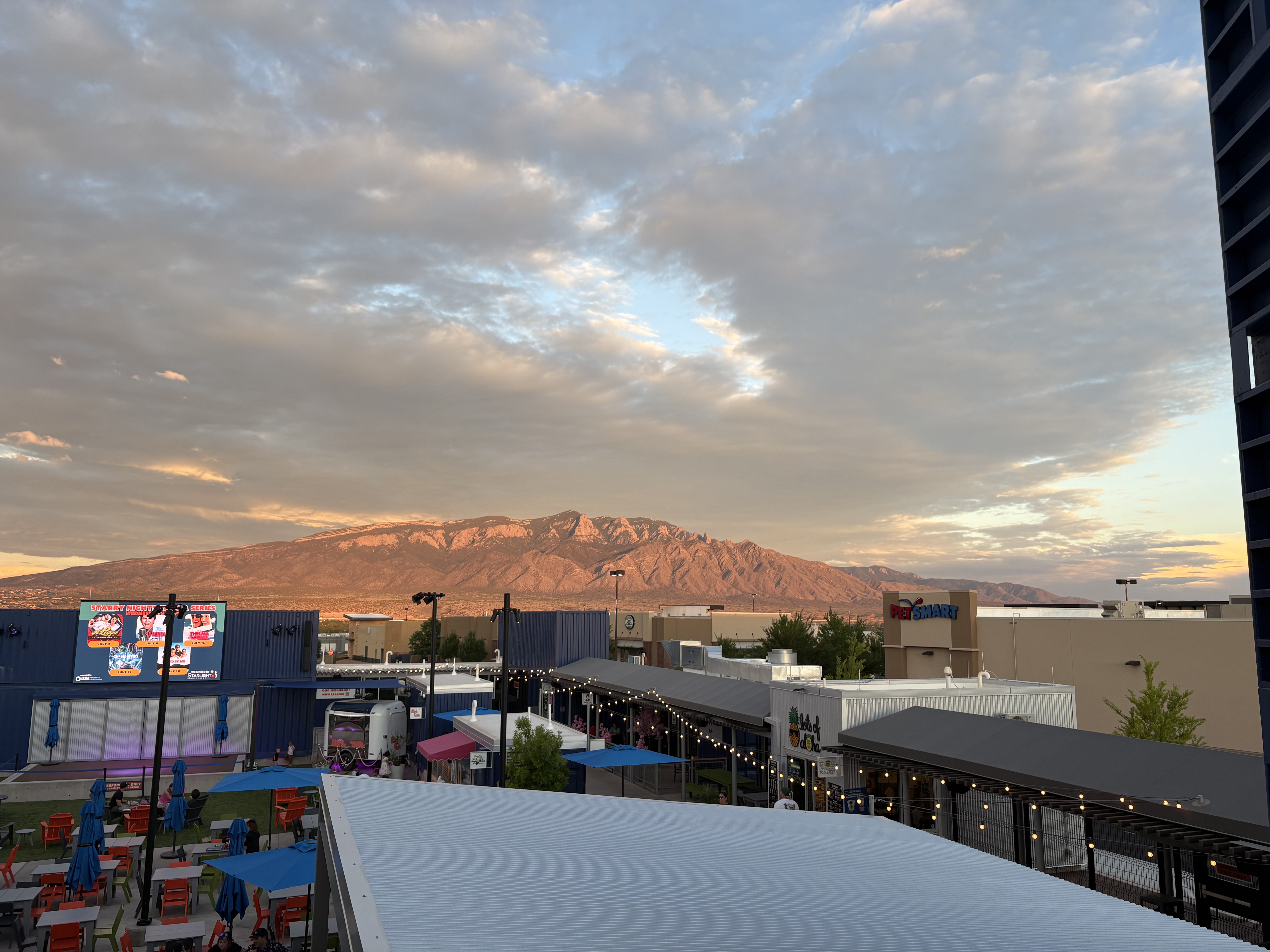 The Sandia Mountains glowing pink at sunset above Albuquerque